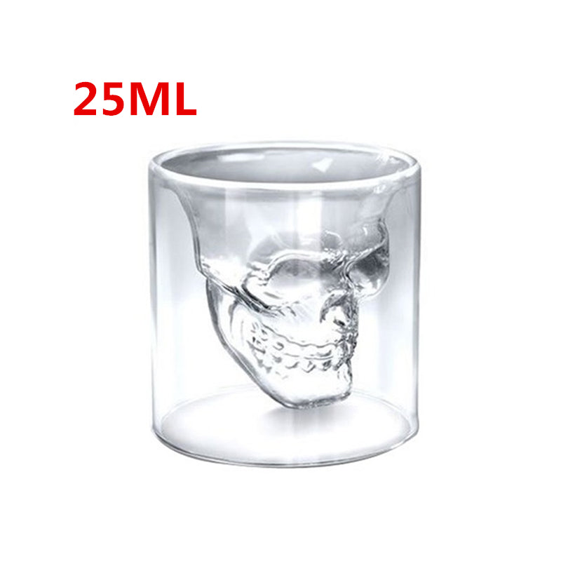 Clear glass skull-shaped shot glass with '25ML' text on a white background