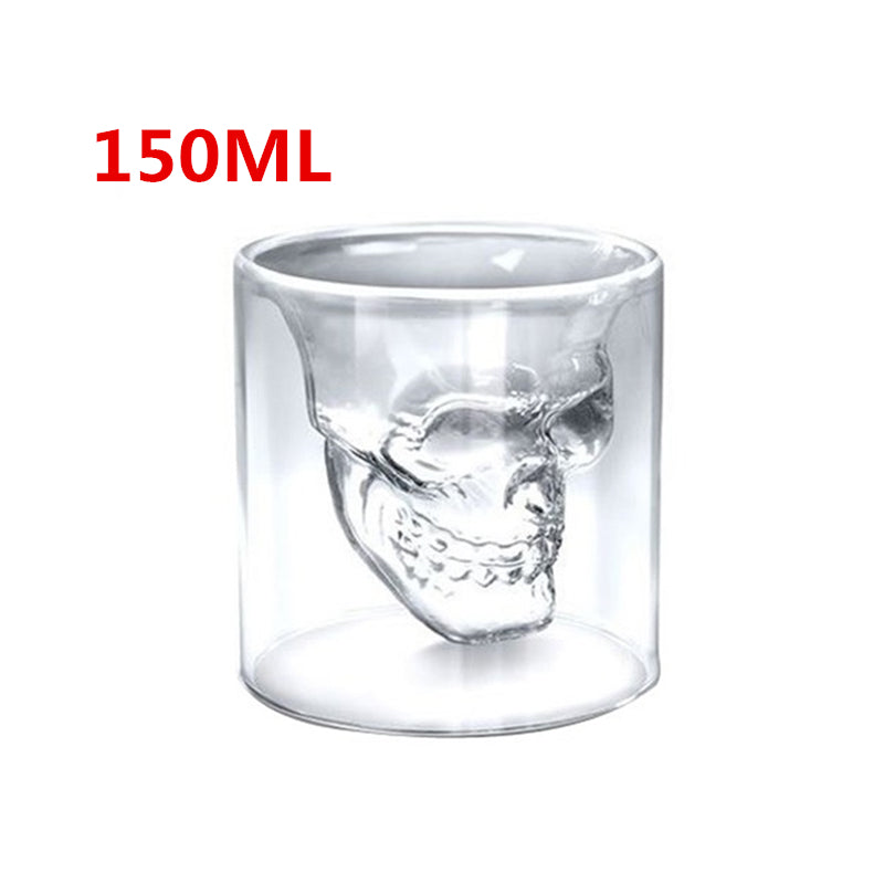 Clear glass skull-shaped cup with '150ML' text on a white background