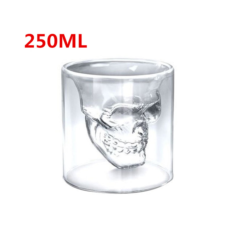 Clear glass skull-shaped tumbler with '250ML' text on a white background