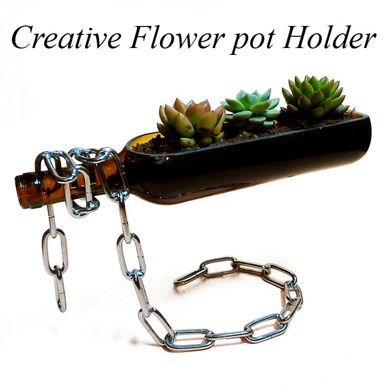 Creative flower pot holder made from a repurposed bottle with succulents on a white background held in a chain wine rack