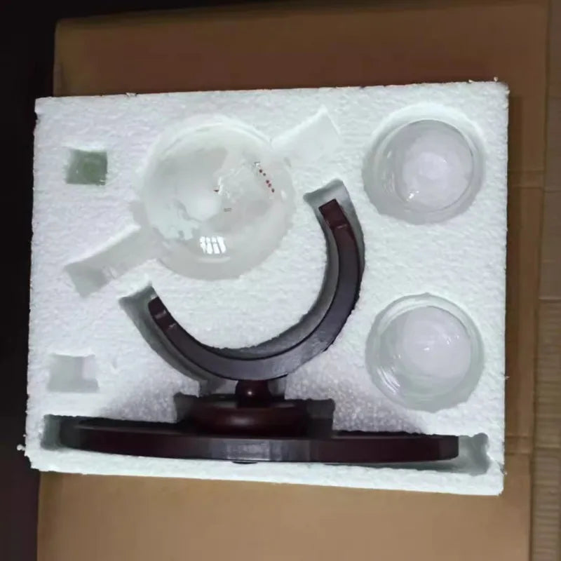 Globe whiskey decanter set with wooden base packed in protective Styrofoam packaging