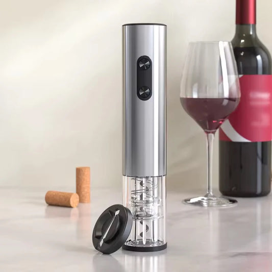 Electric wine opener and foil cutter with a glass of red wine and wine bottle