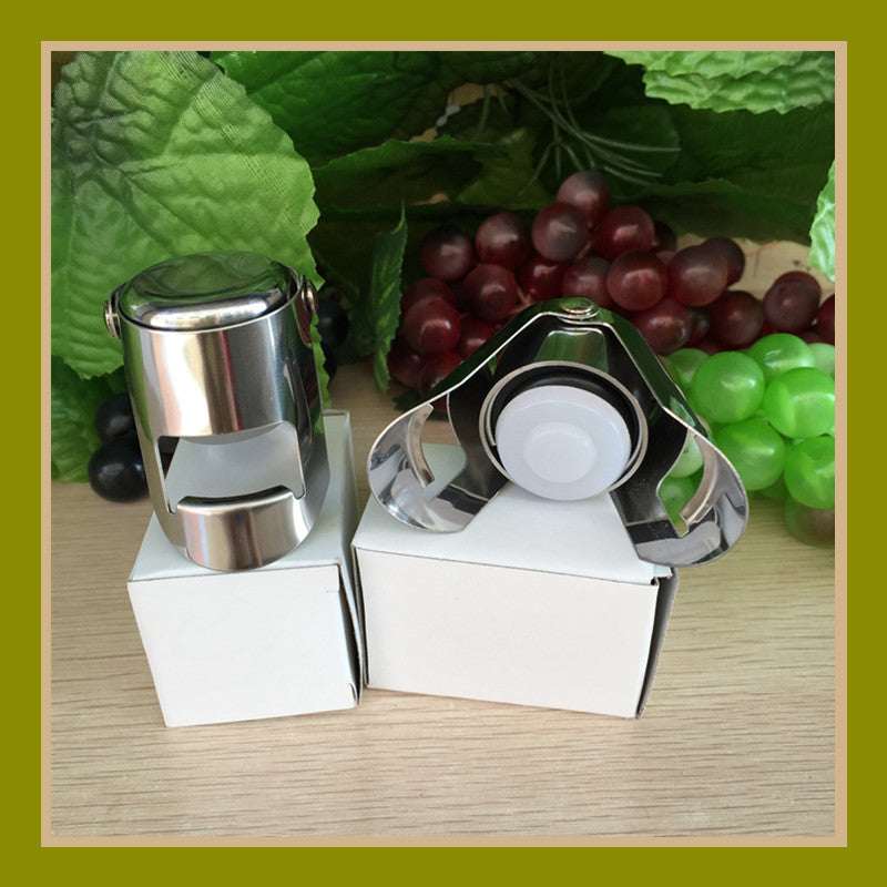 Two silver stainless steel Champagne and sparkling wine bottle stoppers with their packaging
