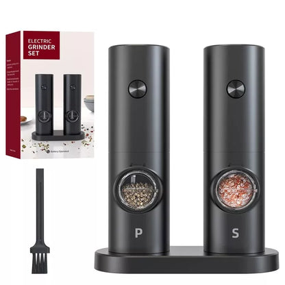 Black automatic salt and pepper grinders with packaging and cleaning brush on a white background