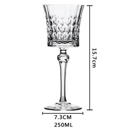 French-style 250ml crystal wine goblet with cut-crystal detailing with dimension lines indicating a height of 15.7 cm and a base diameter of 7.3 cm and 250ml capacity