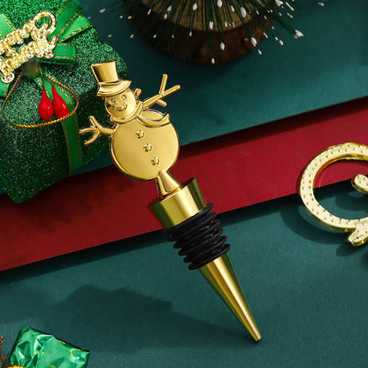 Gold snowman bottle stopper on a festive background with presents and decorations.