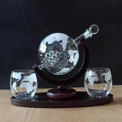 Globe whiskey decanter set with matching glasses on wooden stand, styled against a dark background