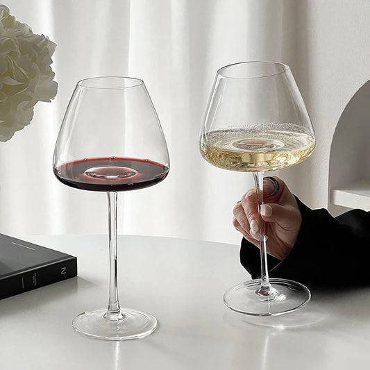 Burgundy crystal wine glasses with red and white wine, showcasing versatile stemware for elegant dining and wine tasting