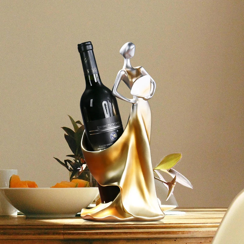Decorative sculpture of a woman holding a wine bottle, displayed as an elegant table accent.