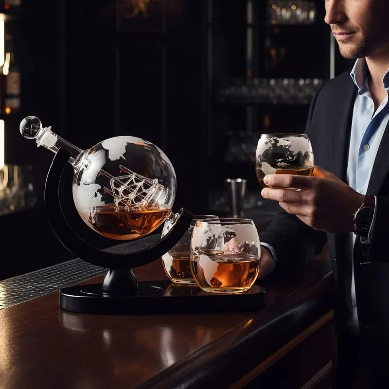 Globe whiskey decanter set on bar cart with whiskey glass in warm ambient lighting