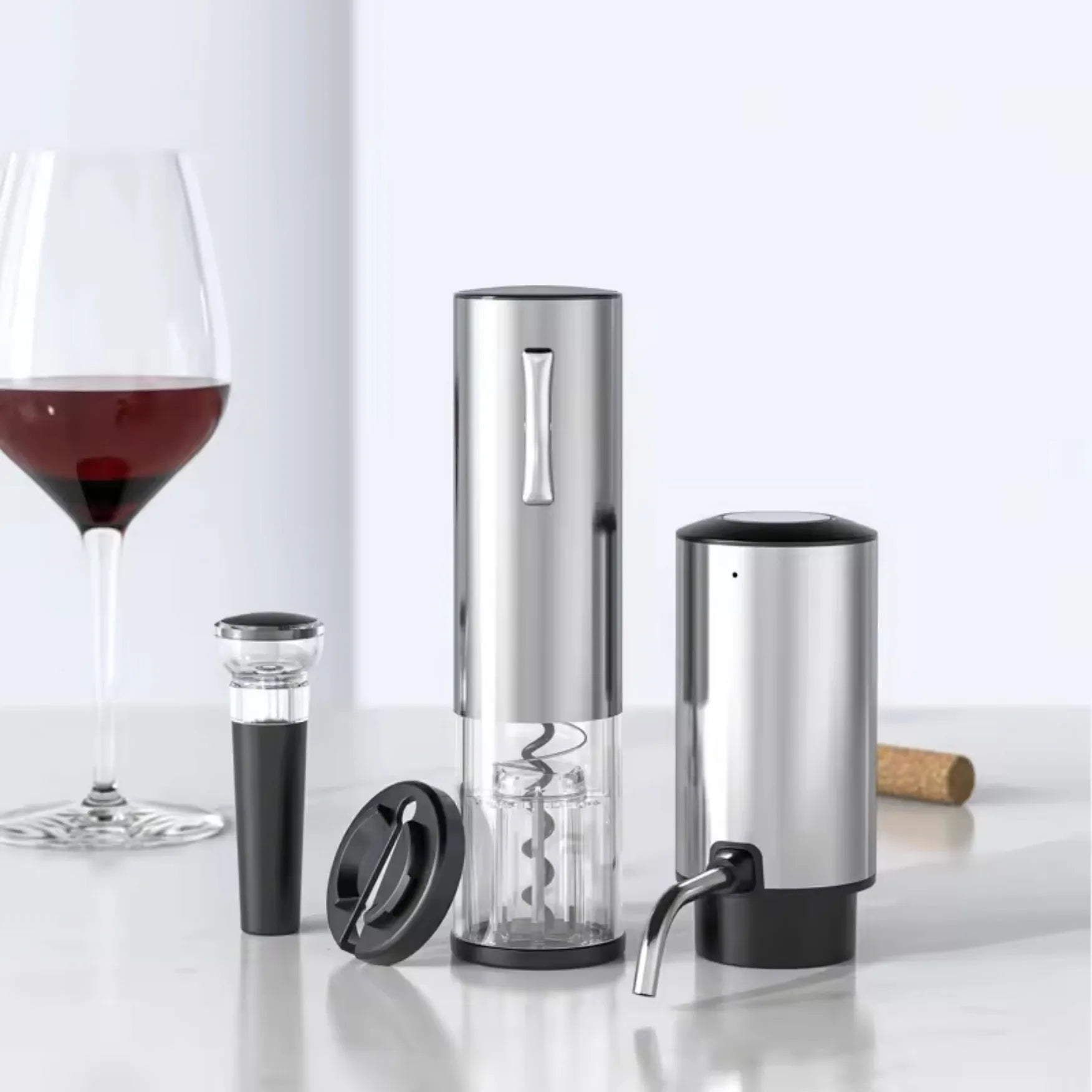 Electric wine opener with accessories on a white surface