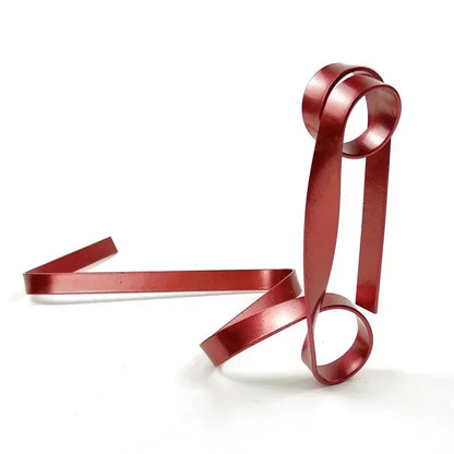 Red ribbon wine rack on a white background