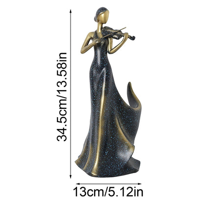 A decorative figurine of a woman in a long glittery dark gown playing a violin, shown on a white background with dimension labels indicating 34.5 cm height and 13 cm width.