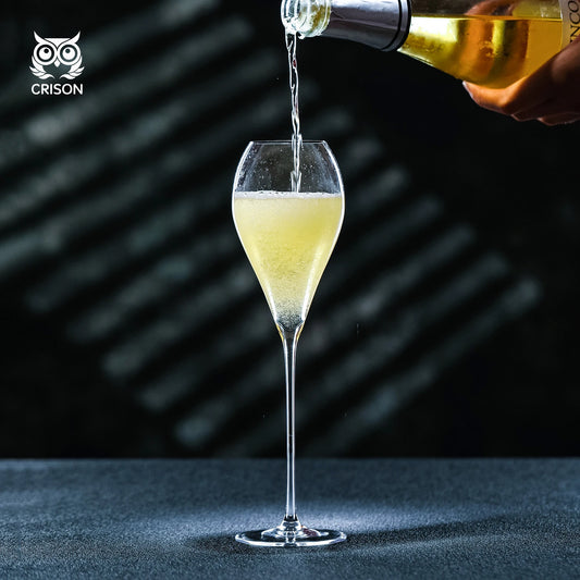 CRISON crystal champagne glass with sparkling wine being poured, showcasing elegant stemware for celebrations, entertaining, and refined hosting