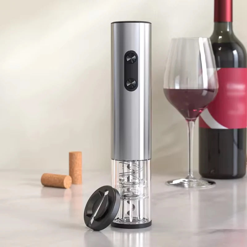Electric wine opener and foil cutter with a glass of red wine and wine bottle