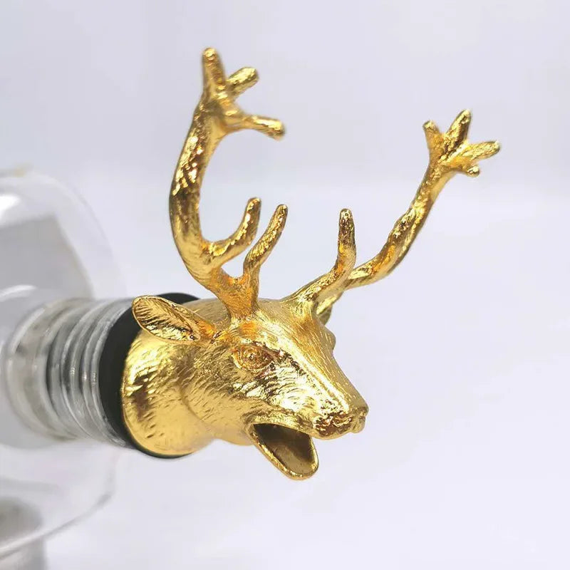 Gold deer head bottle stopper on a white background