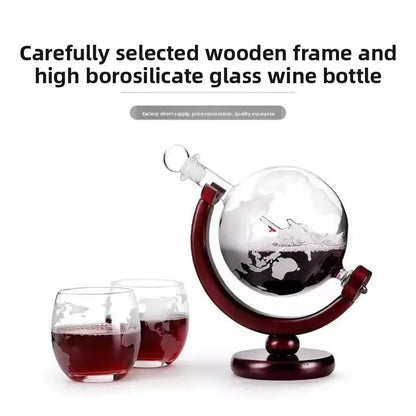 Glass wine decanter with wooden stand and two glasses on a white background
