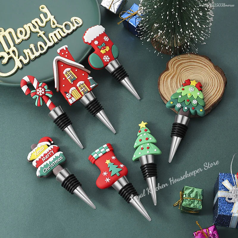 Set of Christmas-themed bottle stoppers on a green surface with decorative elements.