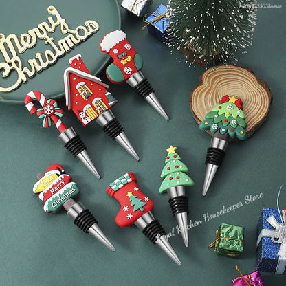 Set of Christmas-themed bottle stoppers on a green surface with decorative elements.