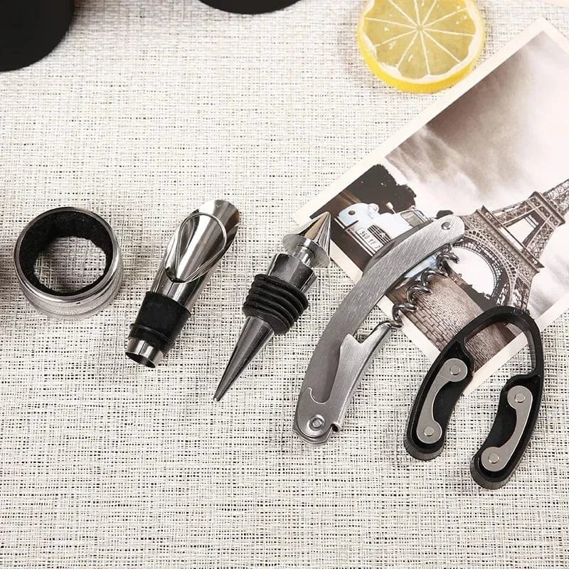 “Flat lay of 5 wine tools including corkscrew, foil cutter, and stopper”

