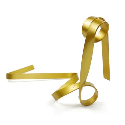 Gold ribbon-shaped wine rack on a white background