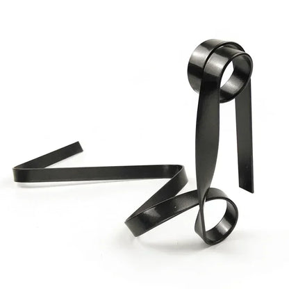 Black metal ribbon wine rack on a white background